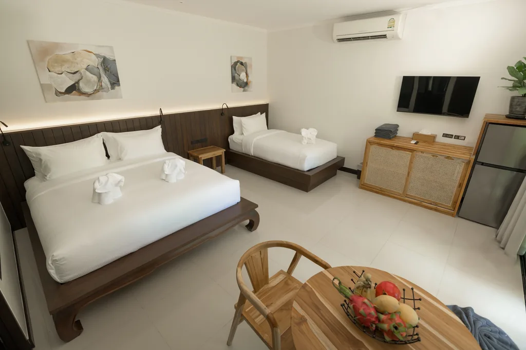 Bedroom with double and single bed, one-bedroom villa