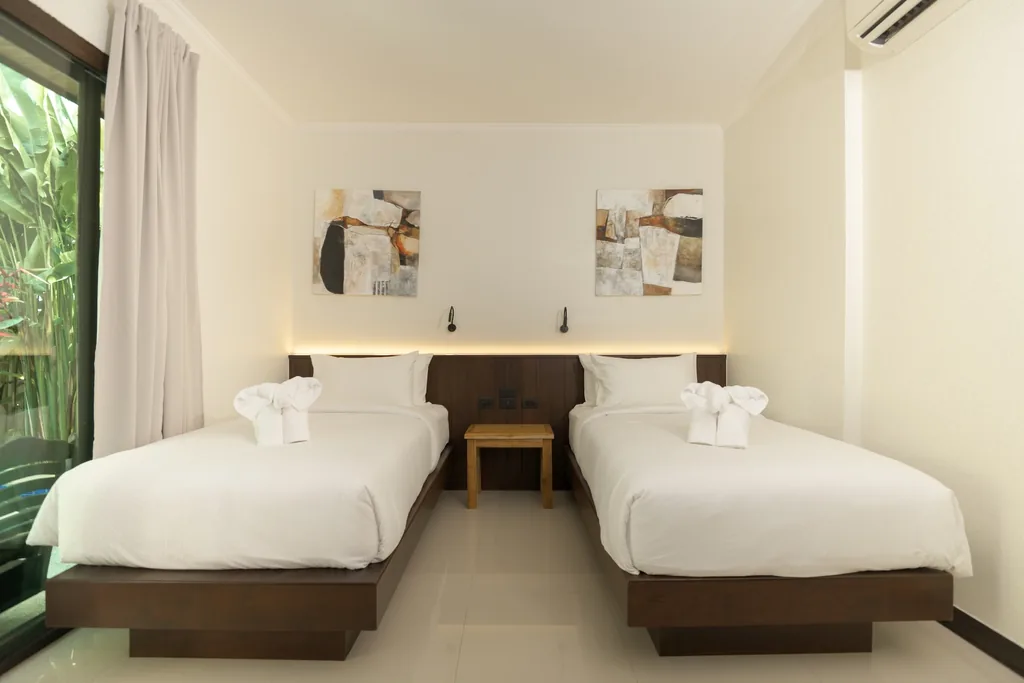 Twin bedroom with two single beds, two-bedroom villa