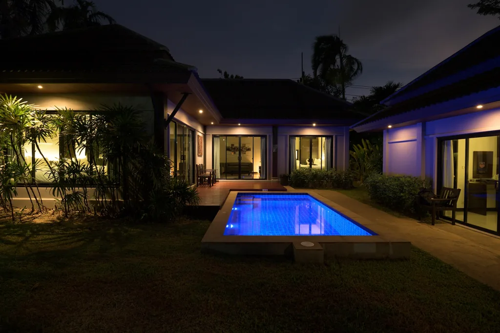 Tropical garden of a three-bedroom villa in Nai Harn