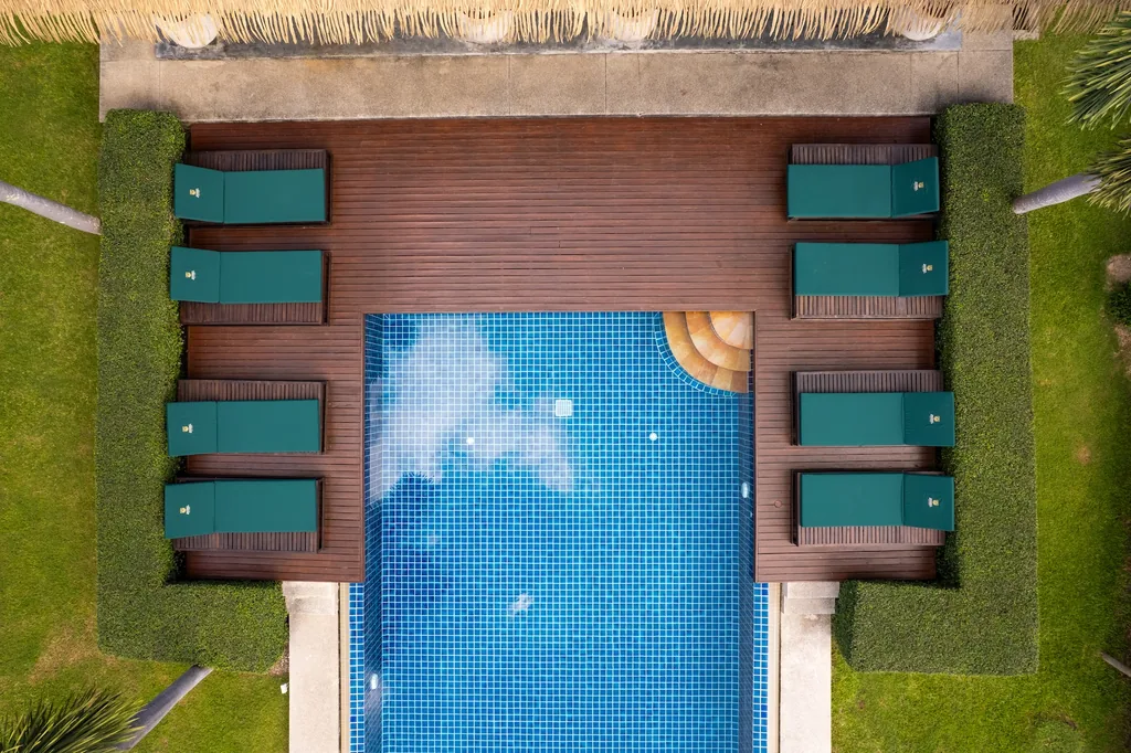 Sun loungers by the shared pool at Green Garden Villas